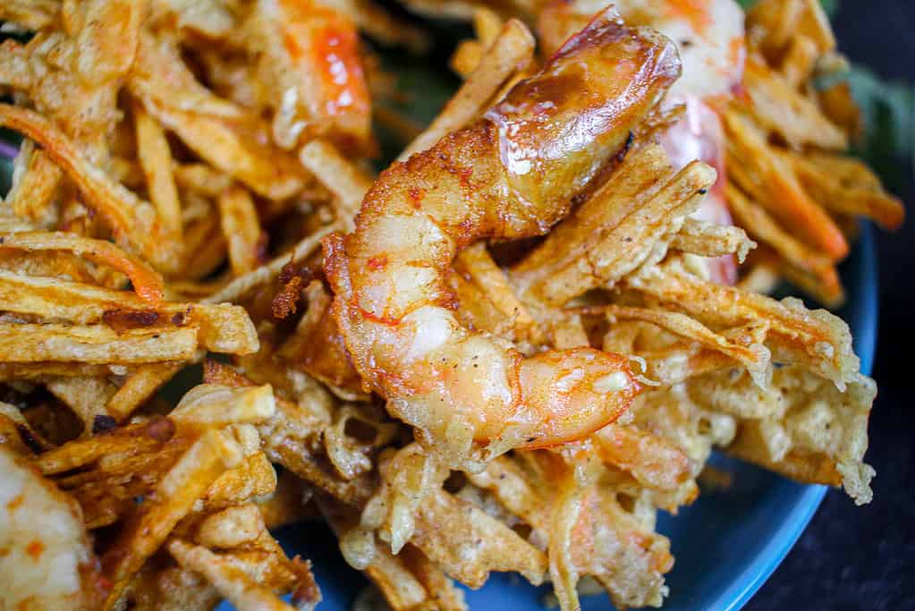 An up close shot of a Vietnamese Shrimp and Sweet Potato Fritters (Bánh Tôm Chiên Khoai Lang)