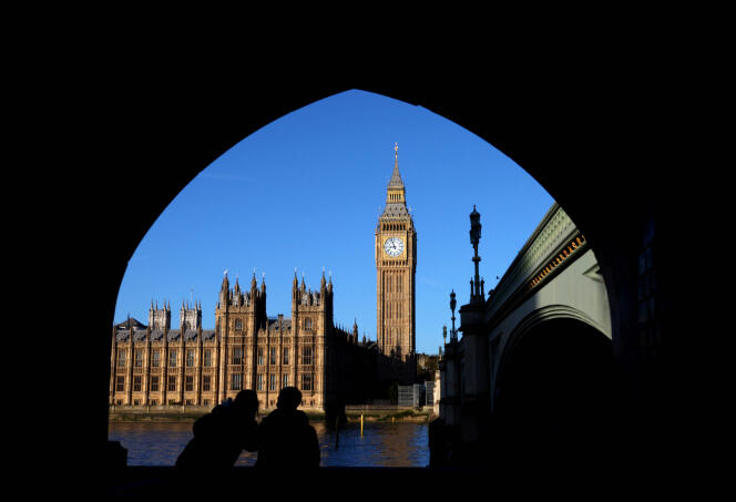 People look towards Big Ben and the Houses of Parliament, where Britain