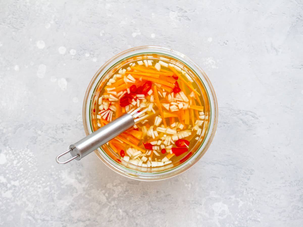 Prepared dipping sauce in a small container with a whisk.