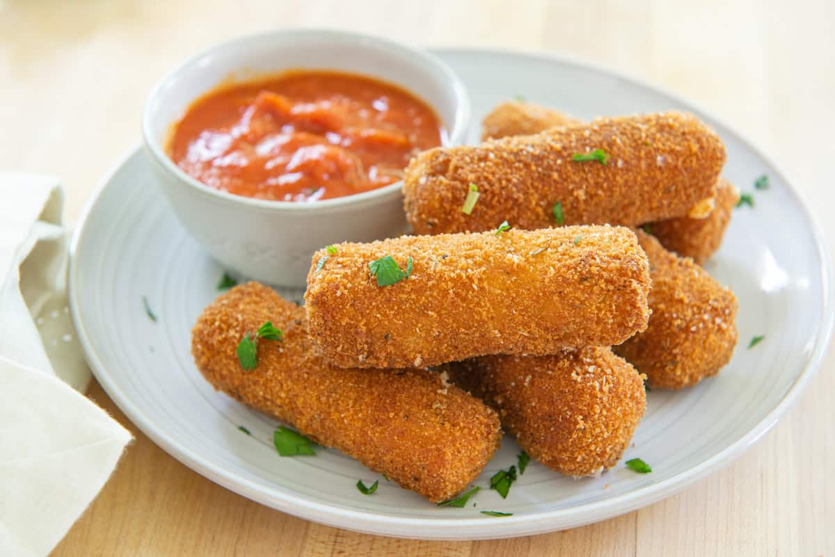 Homemade Cheese Sticks Plate with Marinara and parsley