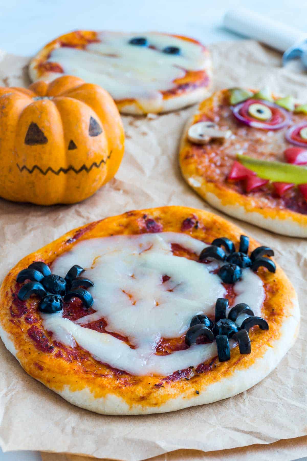 Halloween-themed pizza that looks like a mummy. (The bandages are made of cheese, and the eyes are made of black olive slices.)