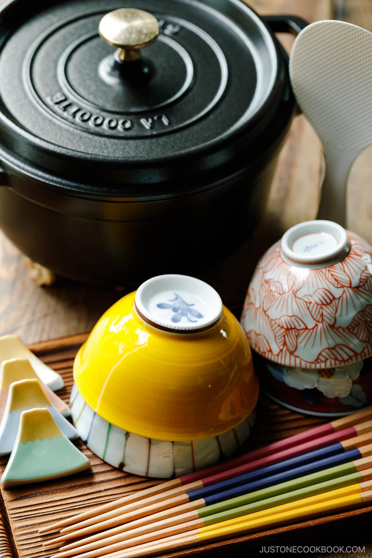 A black Staub and Japanese rice bowls.